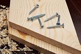 Several screws on wooden planks