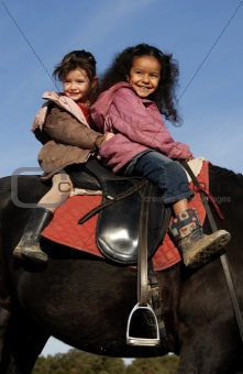 two riding little girls