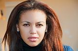 face of a young mulatto woman close-up