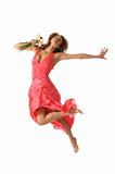 Beautiful young woman jumps with flower