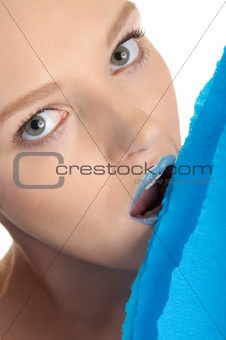 Young woman with dark blue lips and paper