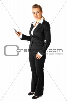  Full length portrait of smiling modern business woman dialing phone number
