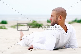 attractive and happy man on beach
