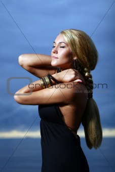 sexy and luxury woman on the sunset backgroung