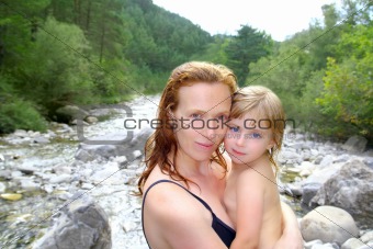 mother daughter playing in river after swimming