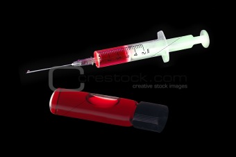 Syringe and medical test tube with bloodon black background