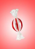 Colourful lollipop isolated on the red background