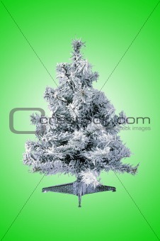 Christmas tree with snow over green background