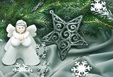 Christmas composition: Angel, a star and a fir branch