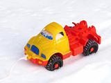Children's plastic machine on snow 