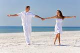 Happy Romantic Couple Dancing Holding Hands on A Tropical Beach