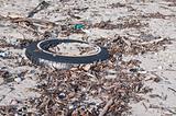 Tire and Other Litter on a Beach