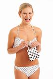 Young woman in bikini with gift bag