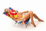 Young woman relaxing in beach chair