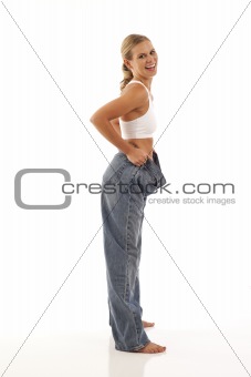 Young woman showing off weight loss