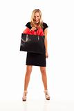 Young woman in black with shopping bag