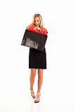 Young woman in black with shopping bag