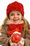Little girl with snowy christmas bauble