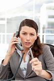 Dissatisfied businesswoman talking on the phone