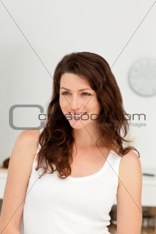 Portrait of a beautiful woman standing in her kitchen