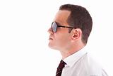 young business man in profile, with sunglasses isolated on white, studio shot