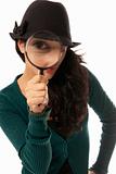 Young woman looking through magnifying glass loupe detective isolated on white background