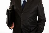 Businessman with  briefcase in hand. Close-up.
