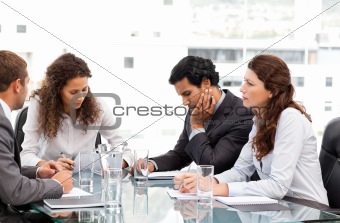 Multi ethnic business team working together during a meeting