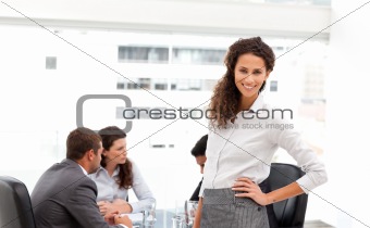 Pretty businesswoman with her team during a meeting