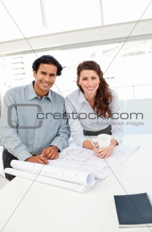 Portrait of happy architects working together