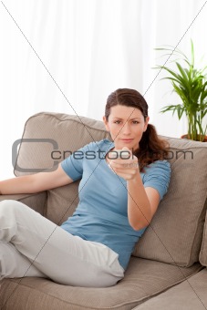 Bored woman waiting for her boyfriend playing video games