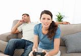 Serious woman playing video game
