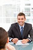 Cheerful businessman during a meeting with a collegue