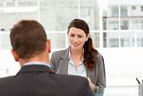 Attractive female manager during a interview with a businessman