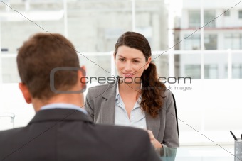 Attractive female manager during a interview with a businessman