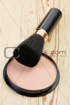 makeup brush and cosmetic powder compact 