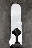 celtic cross in arch window