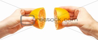 two hands and orange