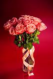 Pink roses bouquet on red background
