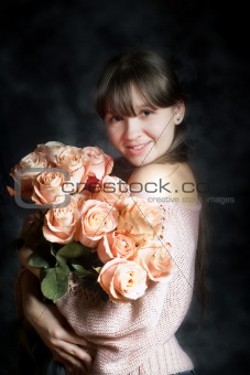 Young girl with bouquet of roses