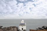 burren lighthouse on cliff edge