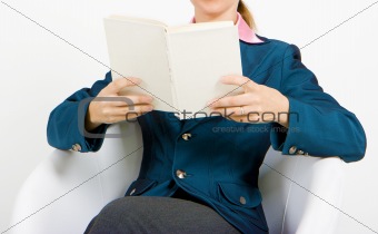 Young business woman reading a book