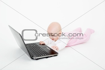 baby playing on the computer