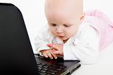 Baby playing with laptop