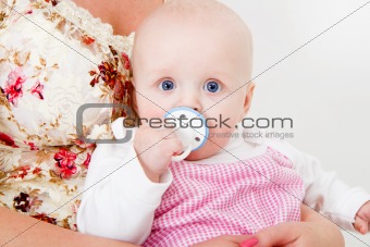 infant with a pacifier