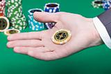 poker chips in the palm of a man