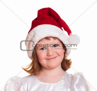 Portrait of pretty christmas girl in white dress and santa hat 