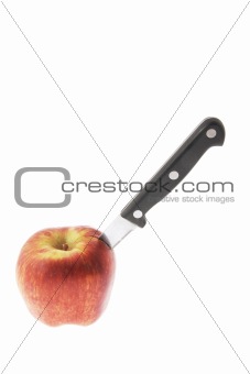 Red Apple with Knife