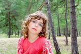 pensive girl in forest nature tree thinking gesture