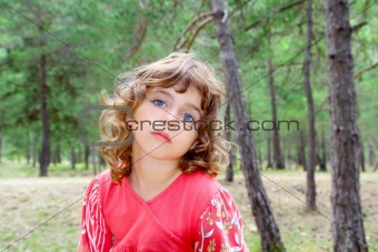 pensive girl in forest nature tree thinking gesture